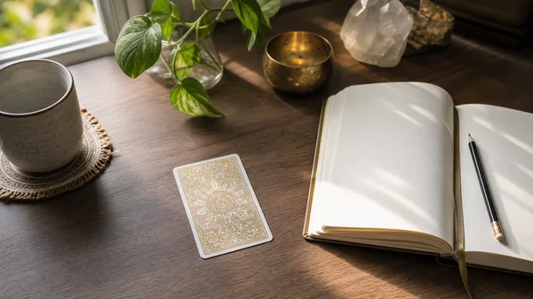 Daily tarot reflection at a desk
